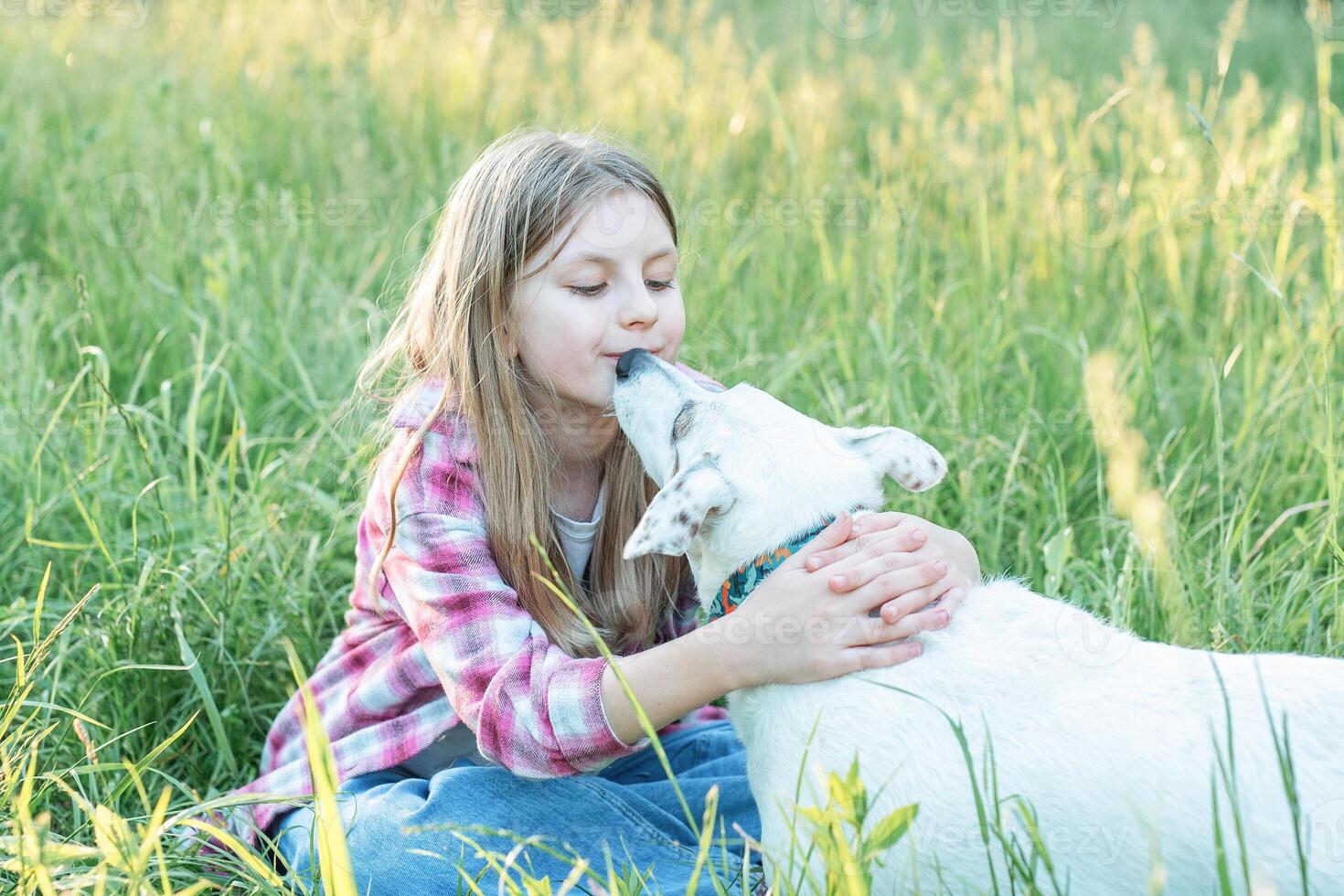 A child with a dog in nature photo