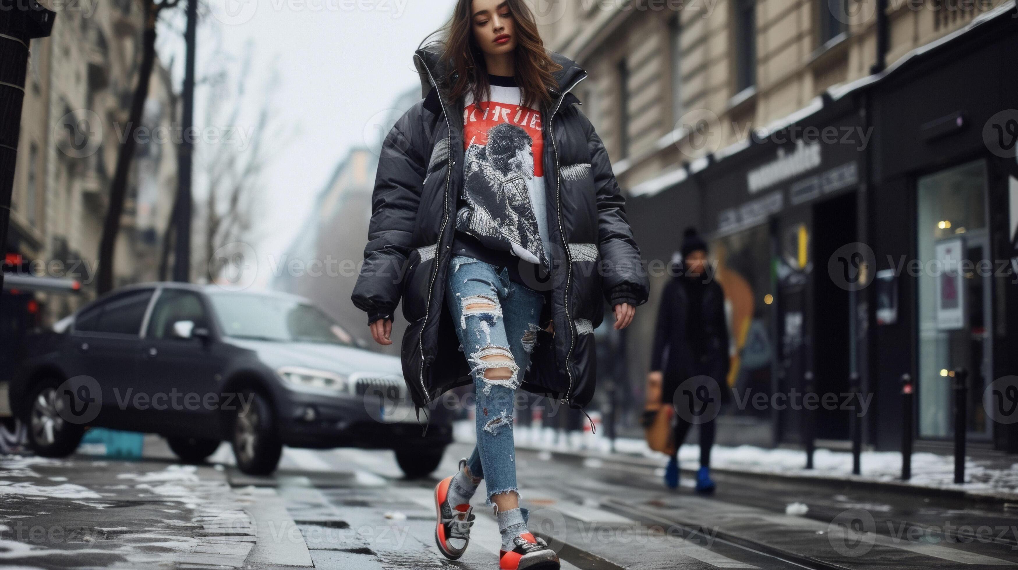 A longline oversized puffer jacket paired with a printed tshirt ripped