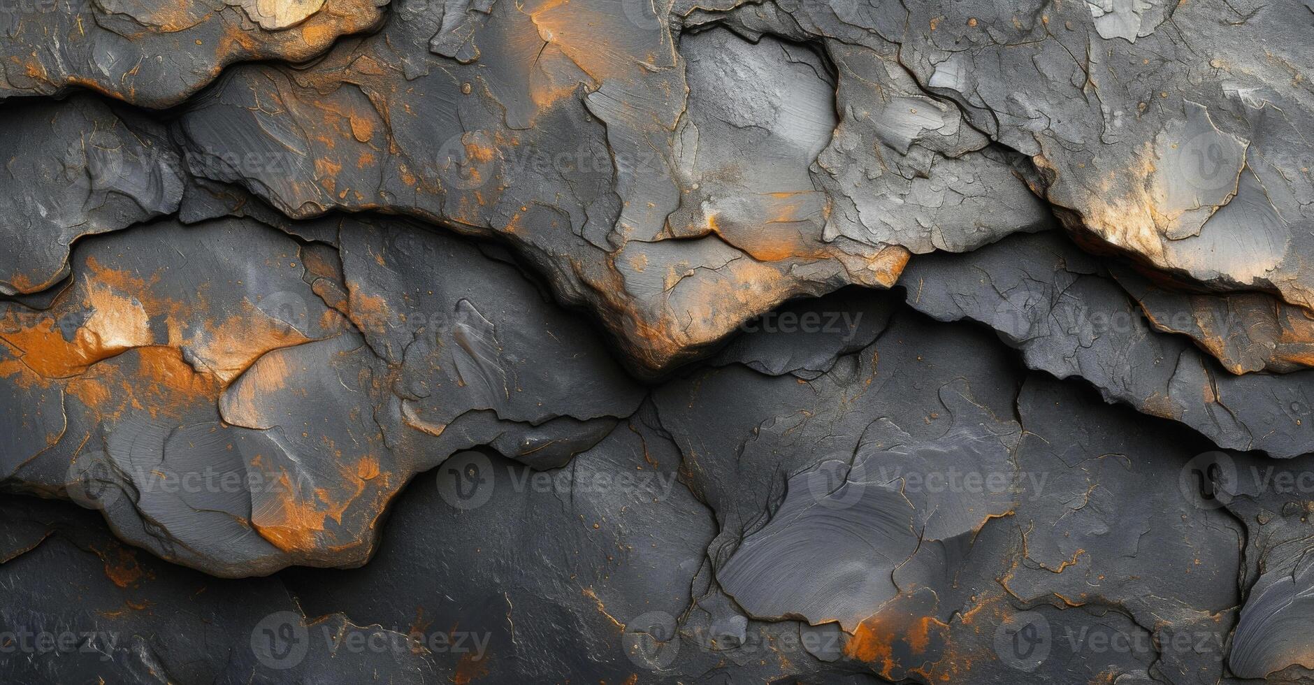 Texture of lava dripping and clinging to a smooth rock surface leaving behind a glossy and marbled look photo