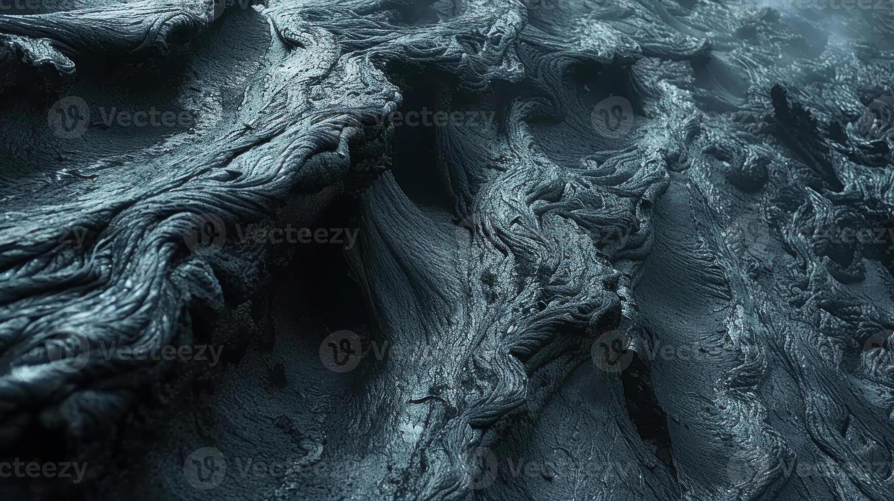 Closeup of lava formations shaped by strong currents creating a mesmerizing rippled and layered texture photo
