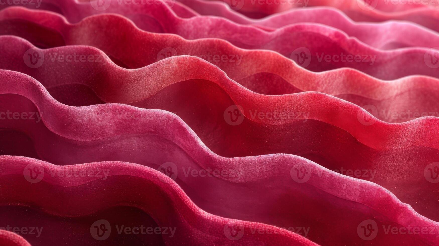 Closeup of layers of overlapping ripples on a burgundy fabric resembling the layers of red rock formations photo