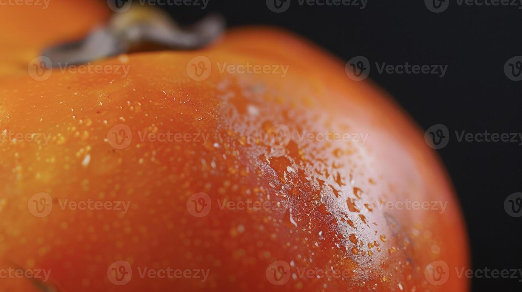 The closeup of a bright orange persimmon with its smooth skin and sweet tangy a fall favorite for baking into cakes or tarts photo