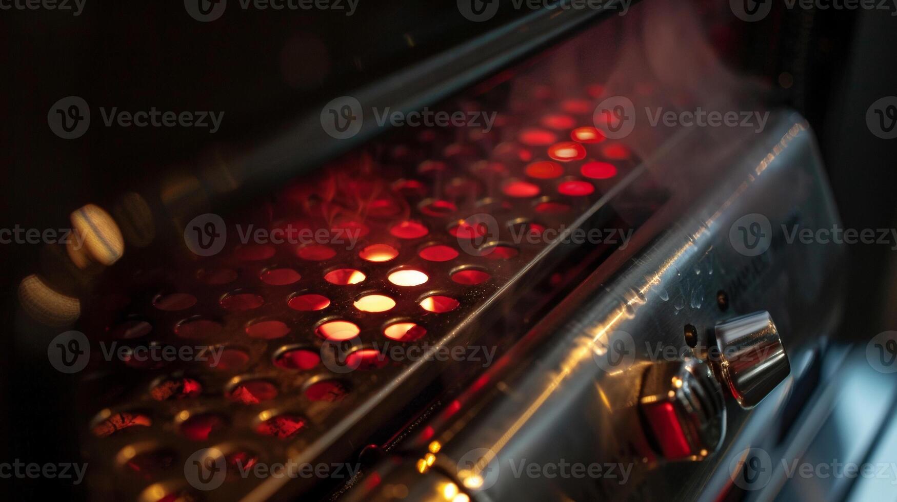 The heating element is visible at the bottom of the smoker emitting a subtle red glow photo