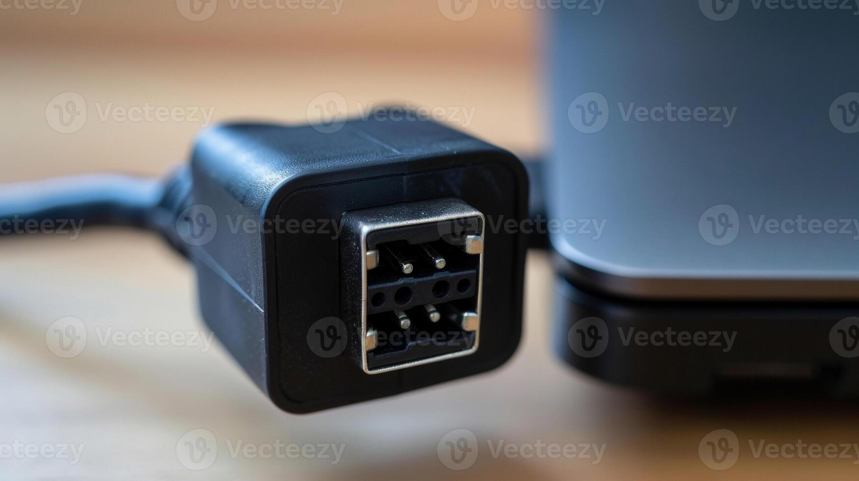 The back of a laptop charger showing the plug and separate charging cord for powering a laptops battery photo