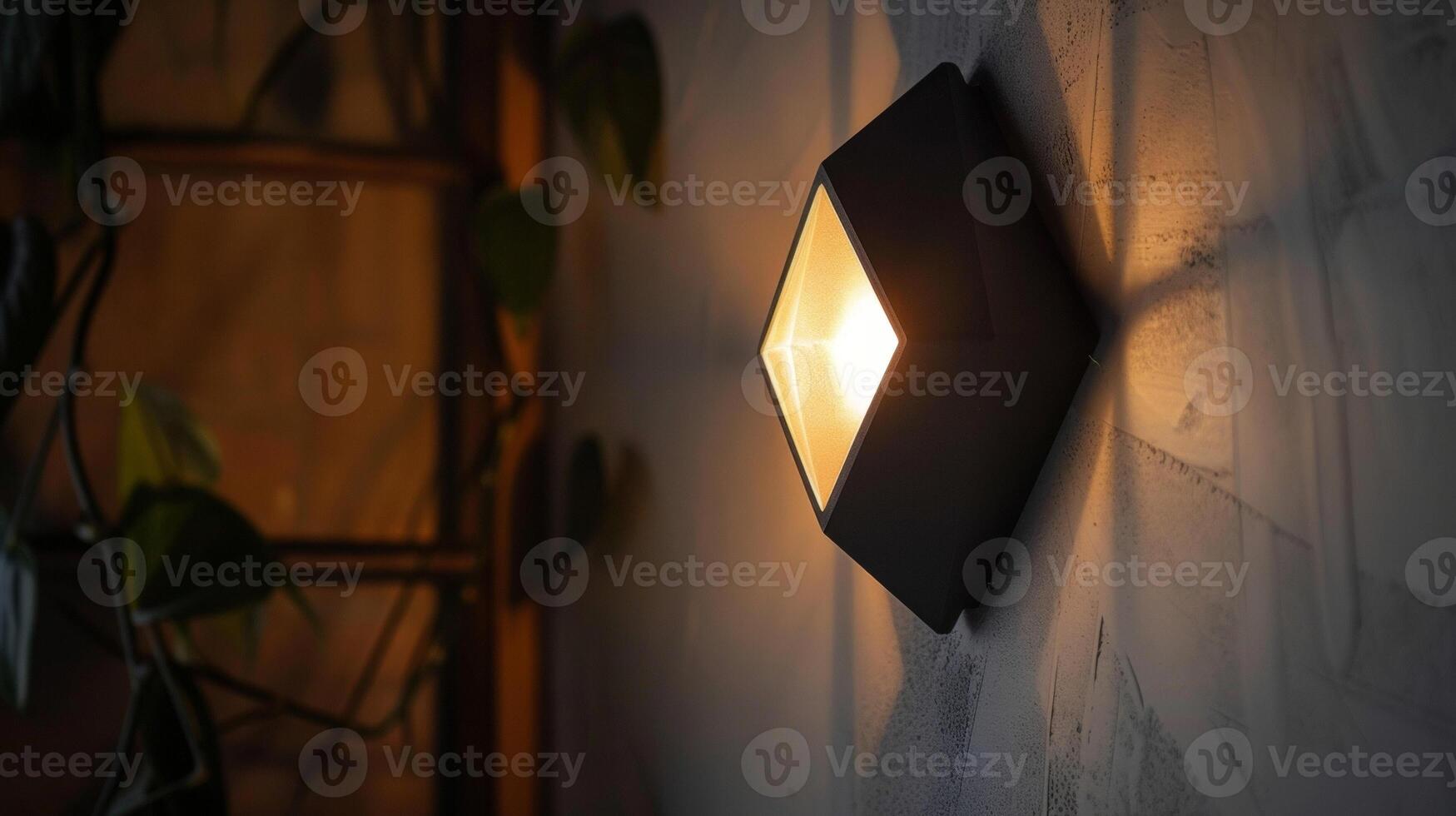 A stylish motion sensor light featuring a geometric diamondshaped design and a matte black finish photo