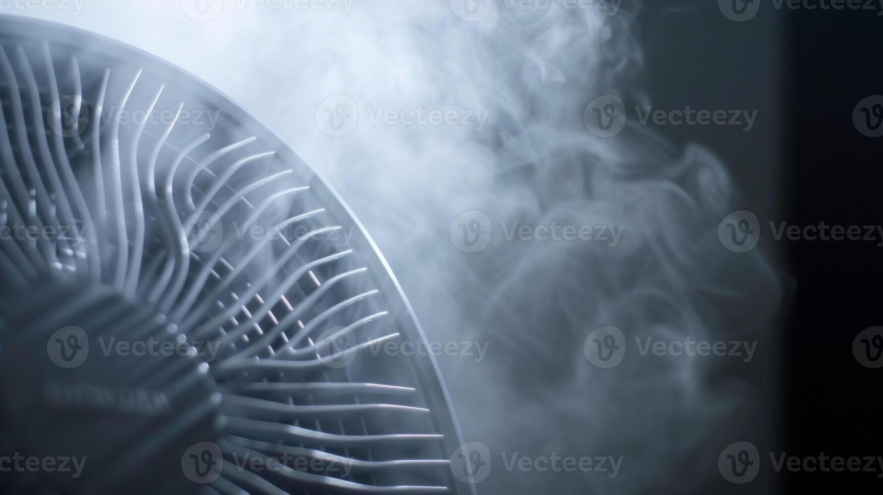 A misty fog forming around the coolers fan blades bringing a natural humidityfree coolness to any room photo