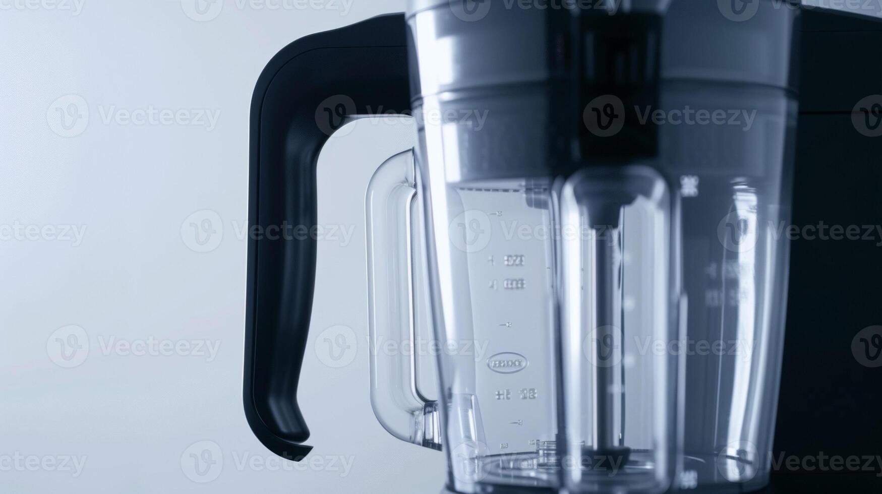 The curved shape of a blenders jug designed for optimal blending and pouring without any spills photo