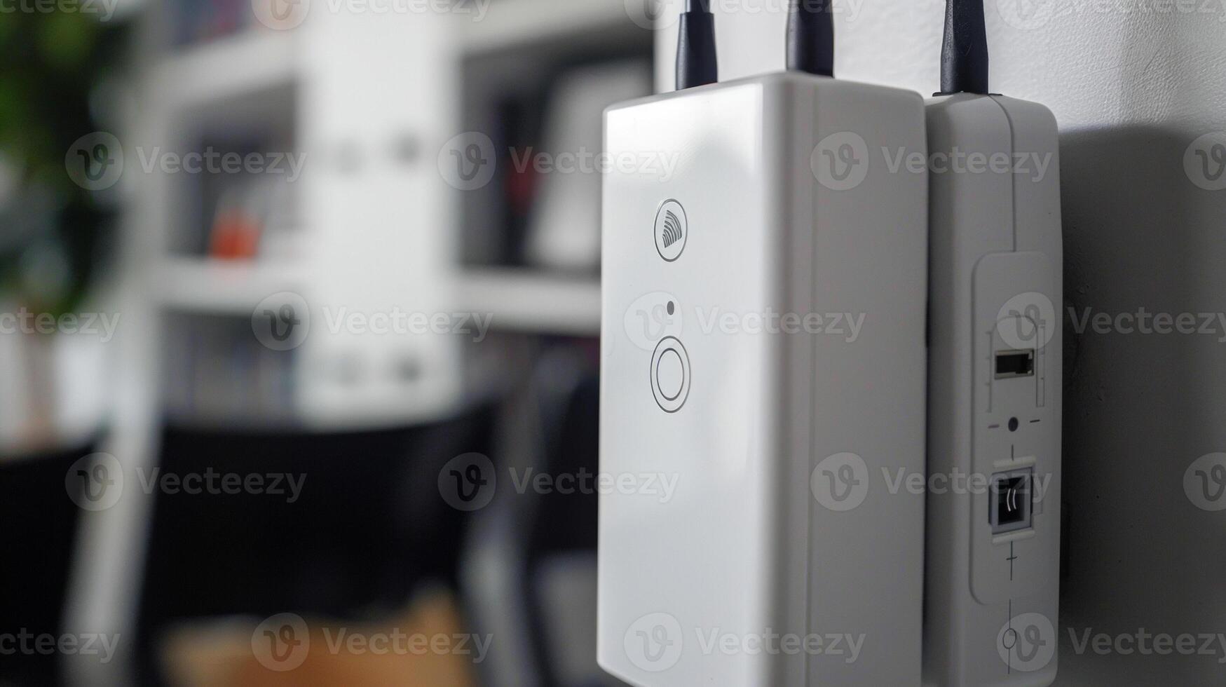 A closeup of the two adjustable antennas on a WiFi range extender perfect for finding the optimal signal strength in any location photo