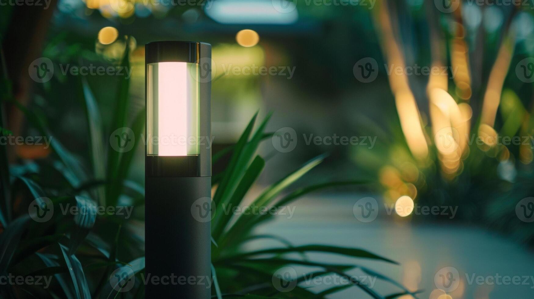 A sleek and modern motion sensor light mounted on a pillar providing bright and convenient lighting for a pathway photo