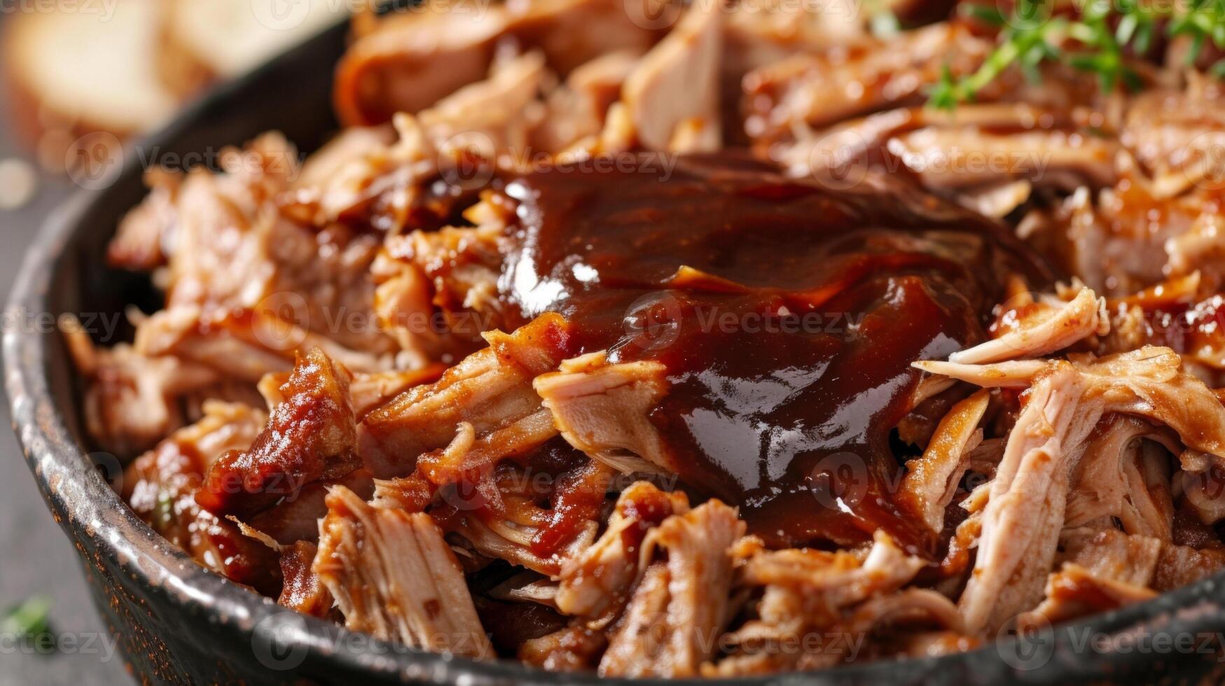 A scoop of tender pulled pork from a crockpot topped with tangy barbecue sauce photo