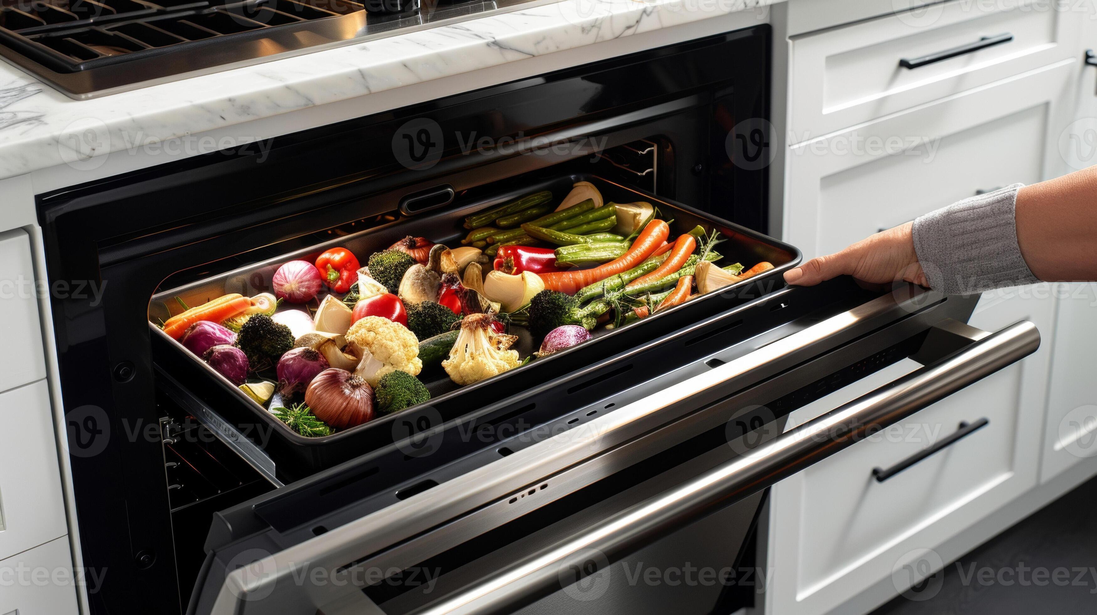 A hand reaching into a convection oven with an oven mitt pulling out a