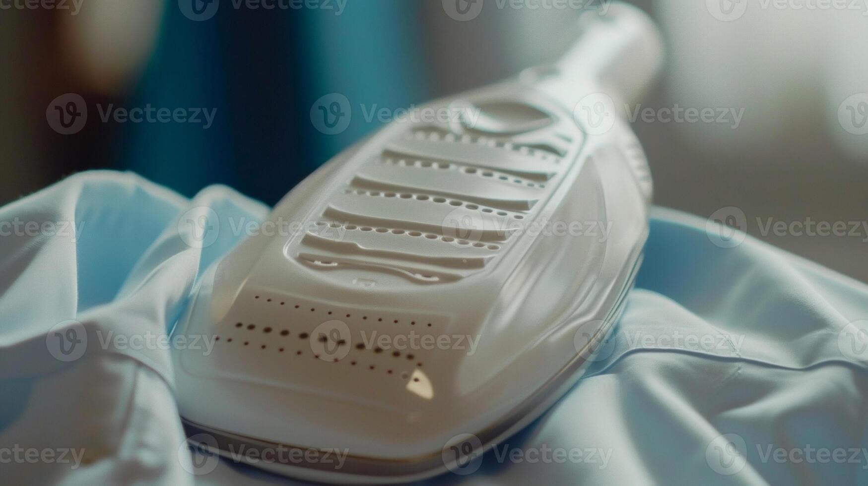 A shot of the irons ceramic soleplate gliding effortlessly over a wrinkled shirt leaving it perfectly smooth photo