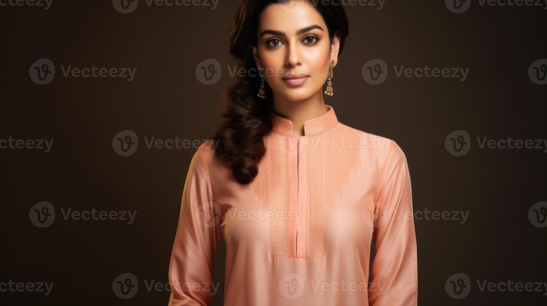 Minimalistic view of a Peach Fuzz colored salwar kameez, with a traditional mandarin collar and modern outs on the sleeves. photo
