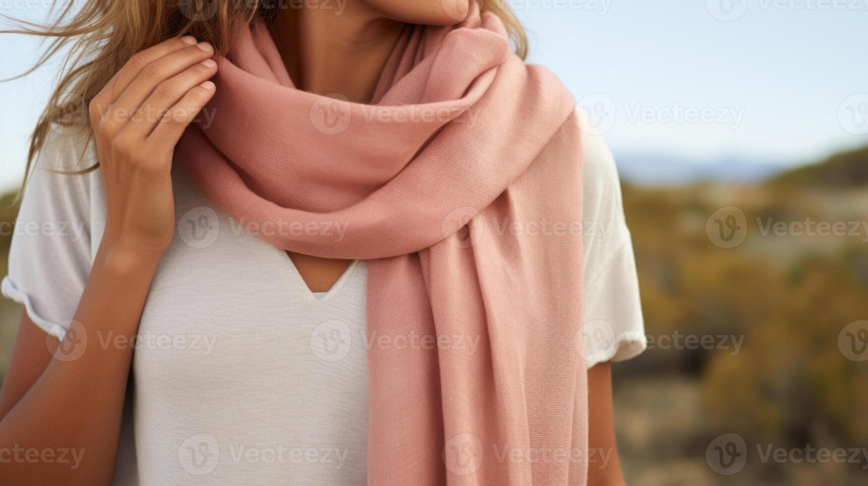 Closeup of a soft, Peach Fuzz colored scarf, handwoven from organic cotton and naturally dyed with plantbased pigments. Each scarf is a testament to the beauty of sustainable fashion. photo