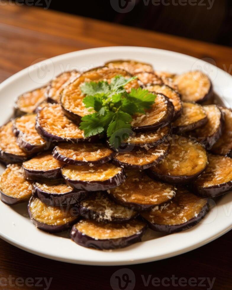 Crispy fried eggplant slices, drizzled with honey and sprinkled with sea salt. The eggplant is lightly breaded and fried to perfection, becoming tender and caramelized on the inside photo