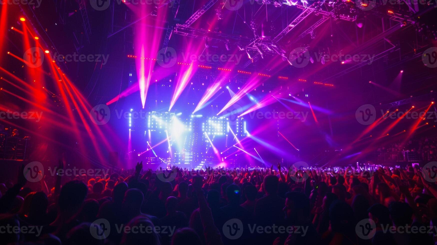 The crowd becomes an active participant in the show moving and swaying to the music as the lights change and move around them photo