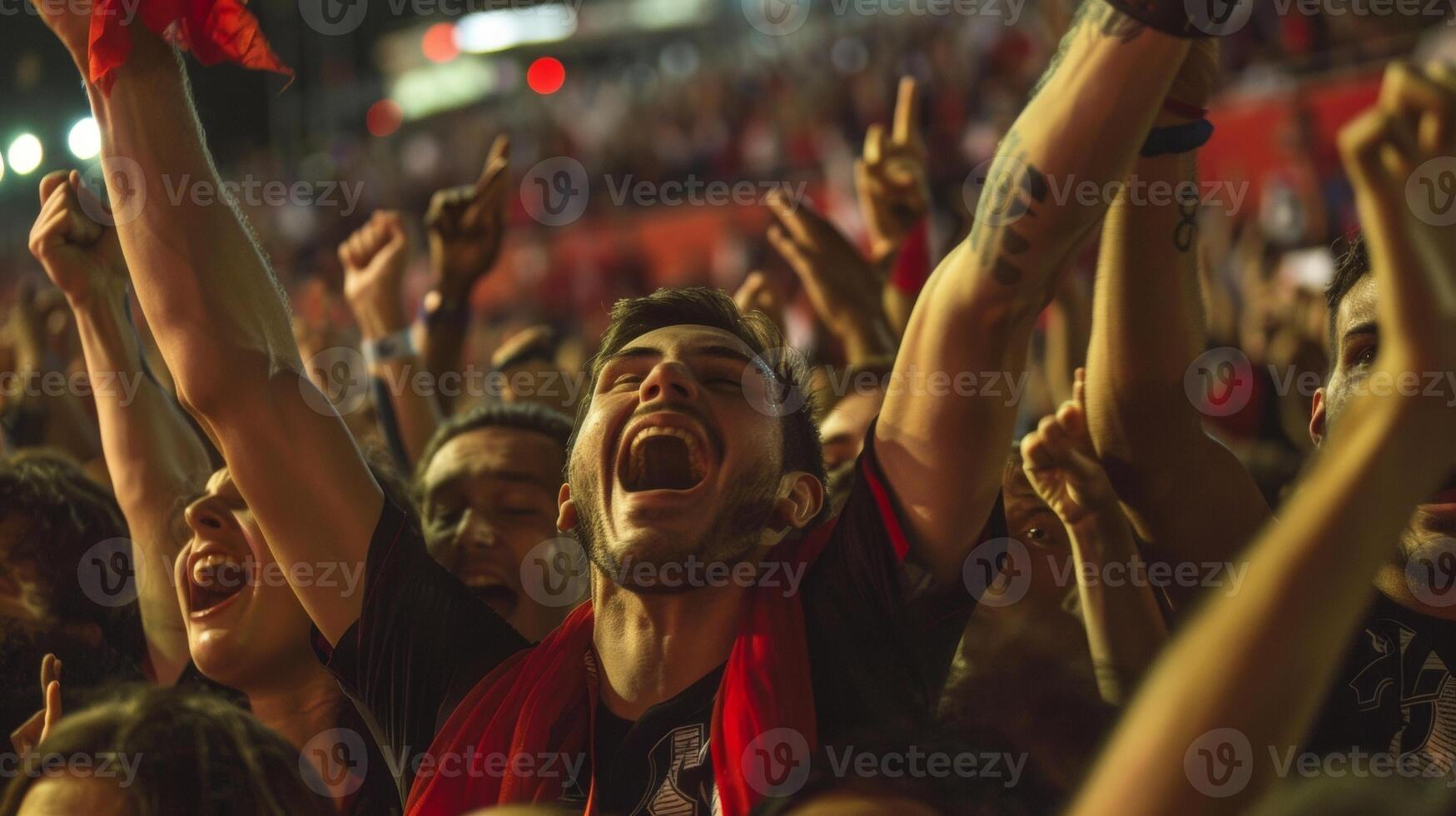 Jumping hugging and screaming are all common sights in the crowd as fans rejoice in their teams win photo