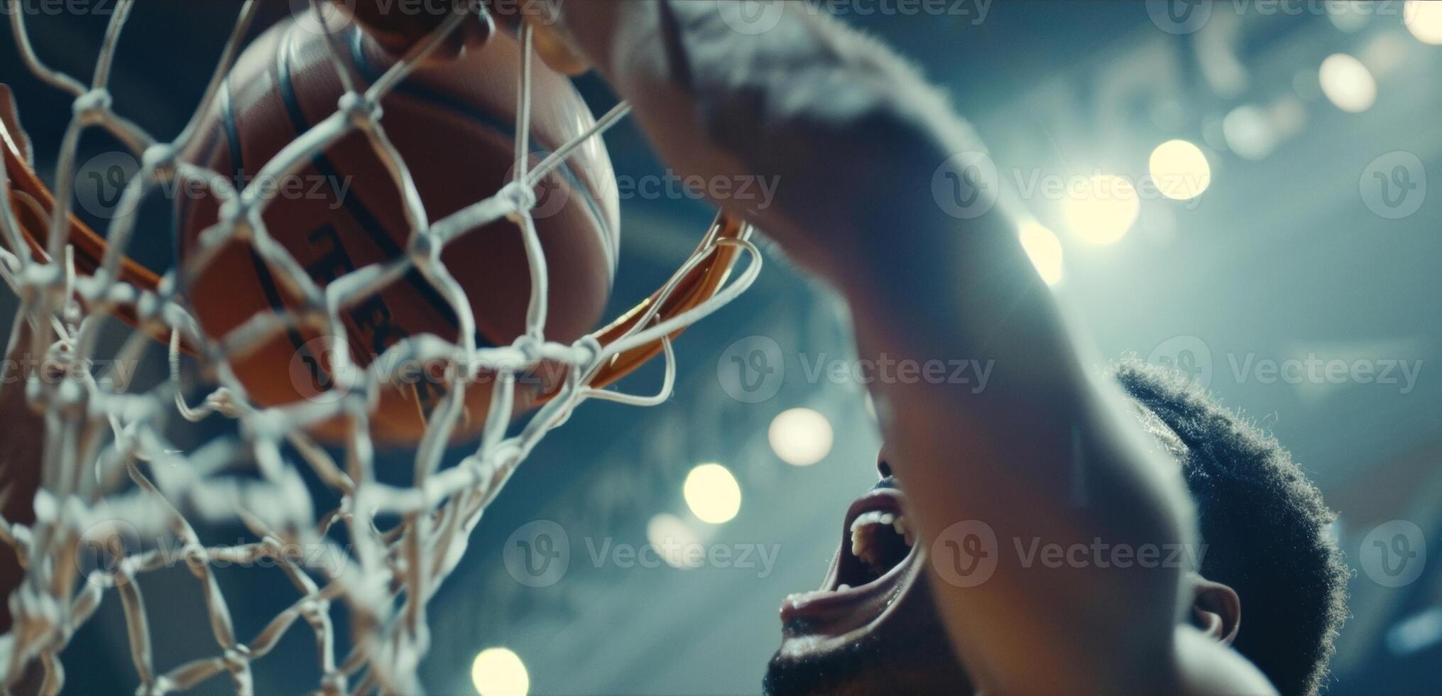 The moment of relief and joy as a basketball player makes the winning shot at the buzzer photo
