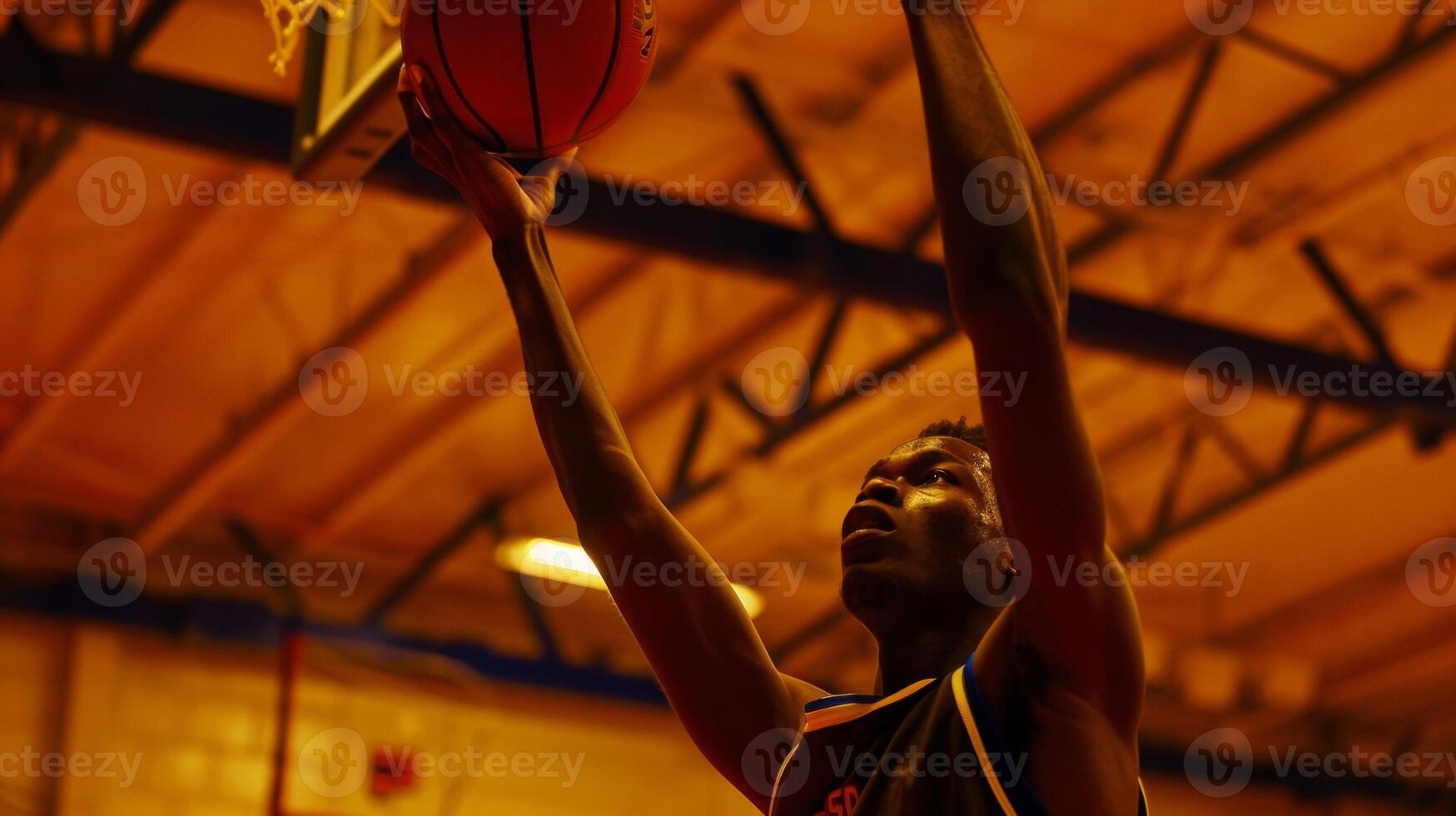 The concentration and precision in a players shooting hand as they take a free throw photo