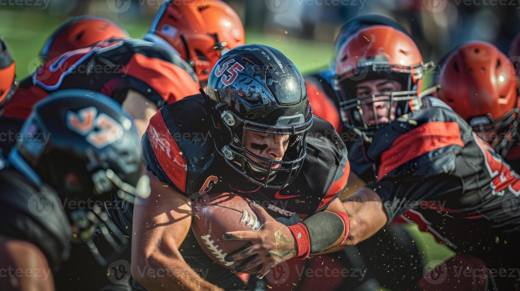 The fierce determination on a football players face as they break through the defense for a touchdown photo