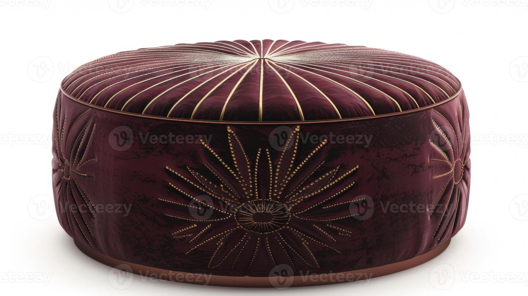 A round velvet ottoman covered in a rich burgundy fabric and embellished with a metallic gold sunburst design. The opulent color and intricate pattern add a touch of Art Deco elegance photo