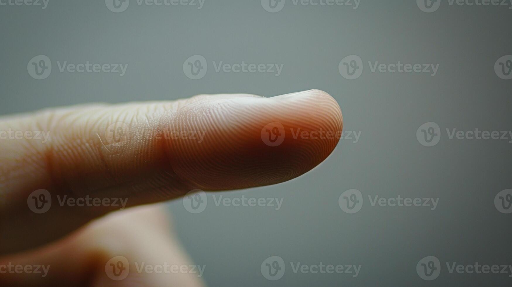 The graceful curve of a finger as it bends at the first knuckle creating a triangular shape between the base of the finger and the hand. photo