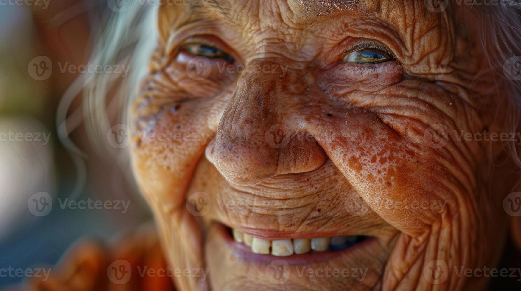 Much like a frame the creases of her laughter lines beautifully encase her face a testament to a life bursting with mirth and glee. photo