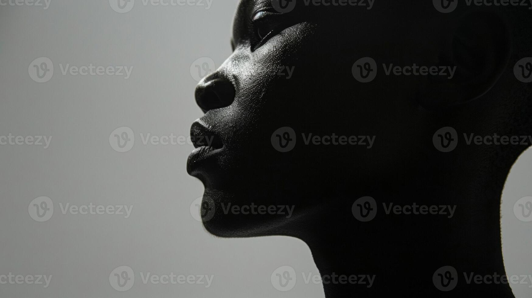 The silhouette of s on the face and neck highlight the fragility and strength of the human body. photo