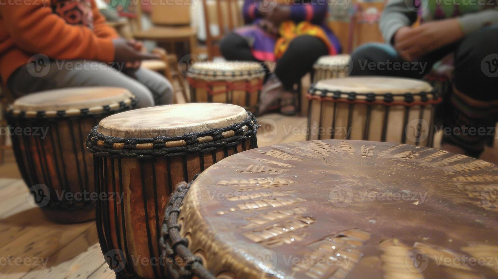 Thick hides stretched tightly over the drums frame creating the deep resounding beat that permeates the room inviting participants to join in the healing rhythm photo