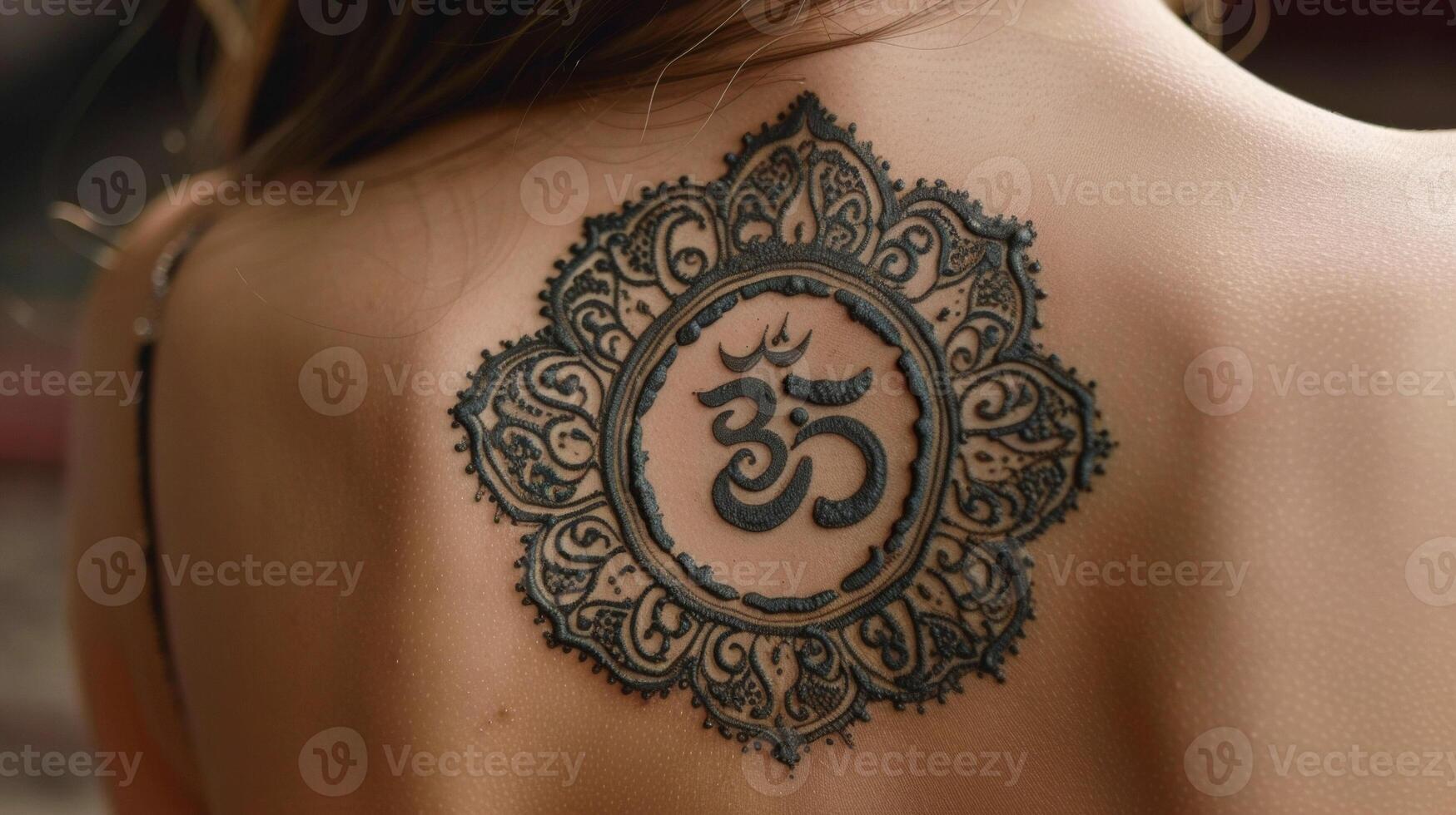 A closeup of a womans intricate henna tattoo featuring a pattern of ss symbolizing the power of transformation and healing in many cultures photo