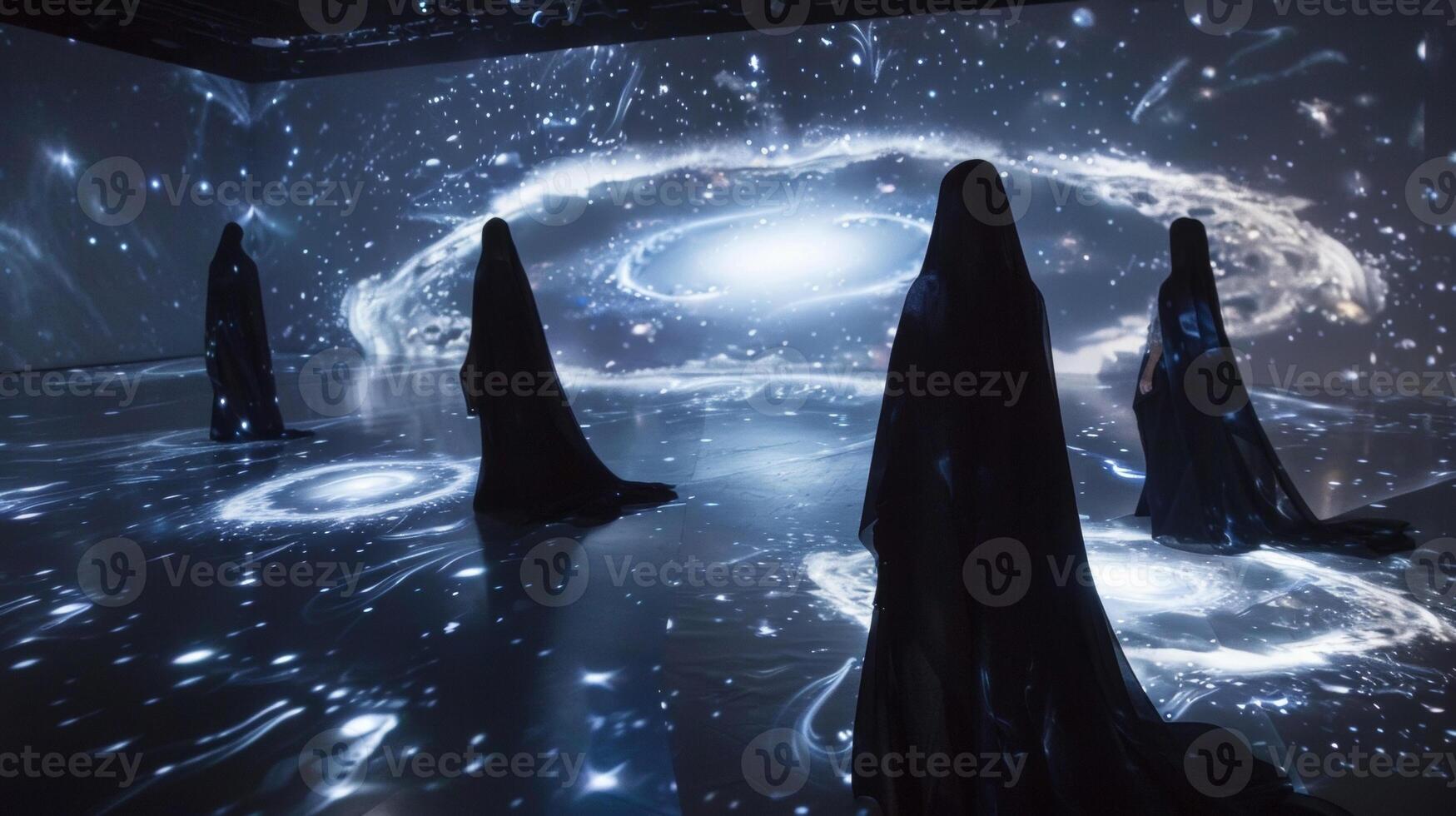 A dark room is transformed into a mystical world with swirling galaxies projected onto flowing capes and gowns showcasing the endless possibilities and creativity of projectio photo