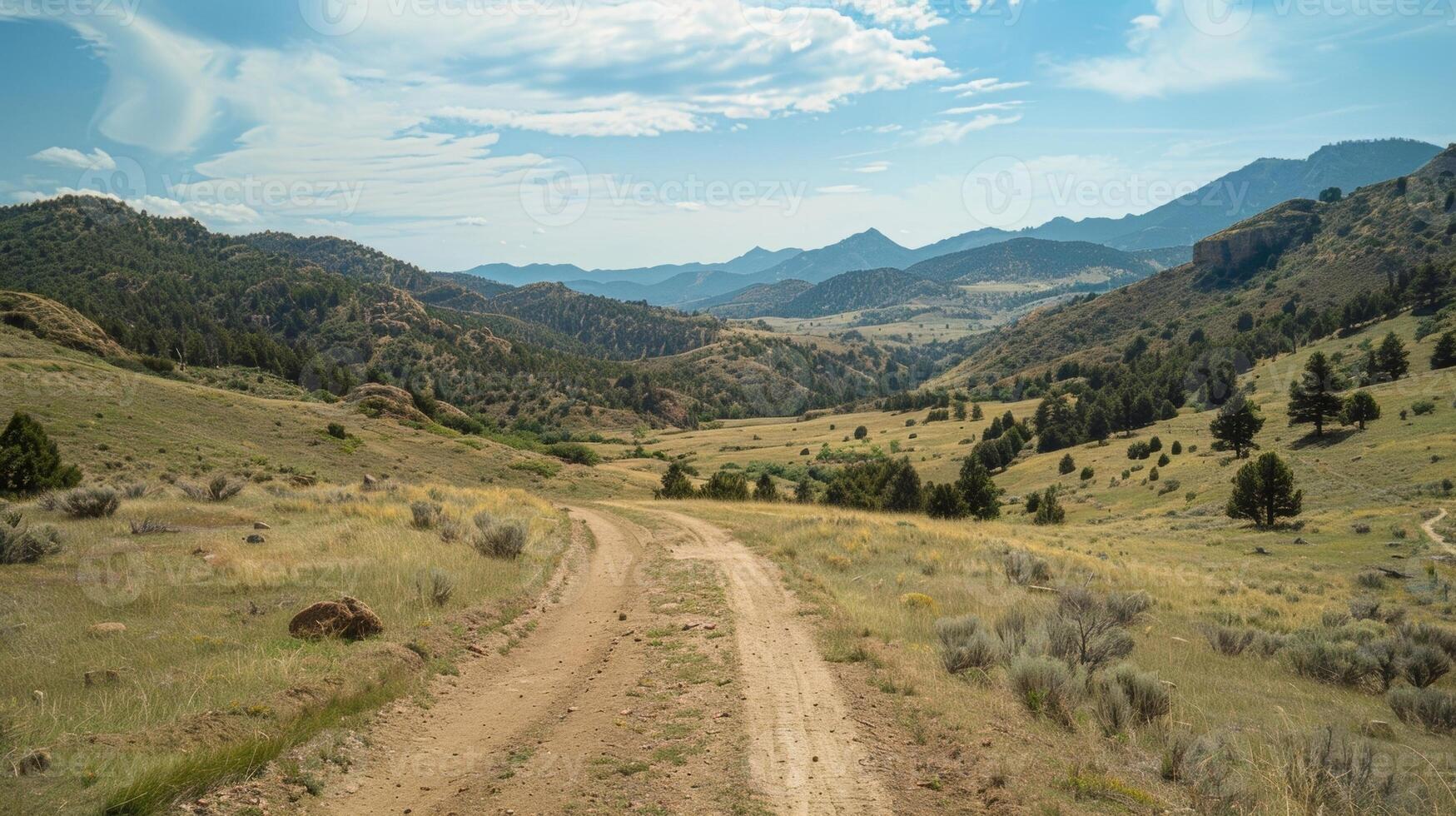 A scenic ride through the mountains with breathtaking views of rolling hills and distant peaks photo