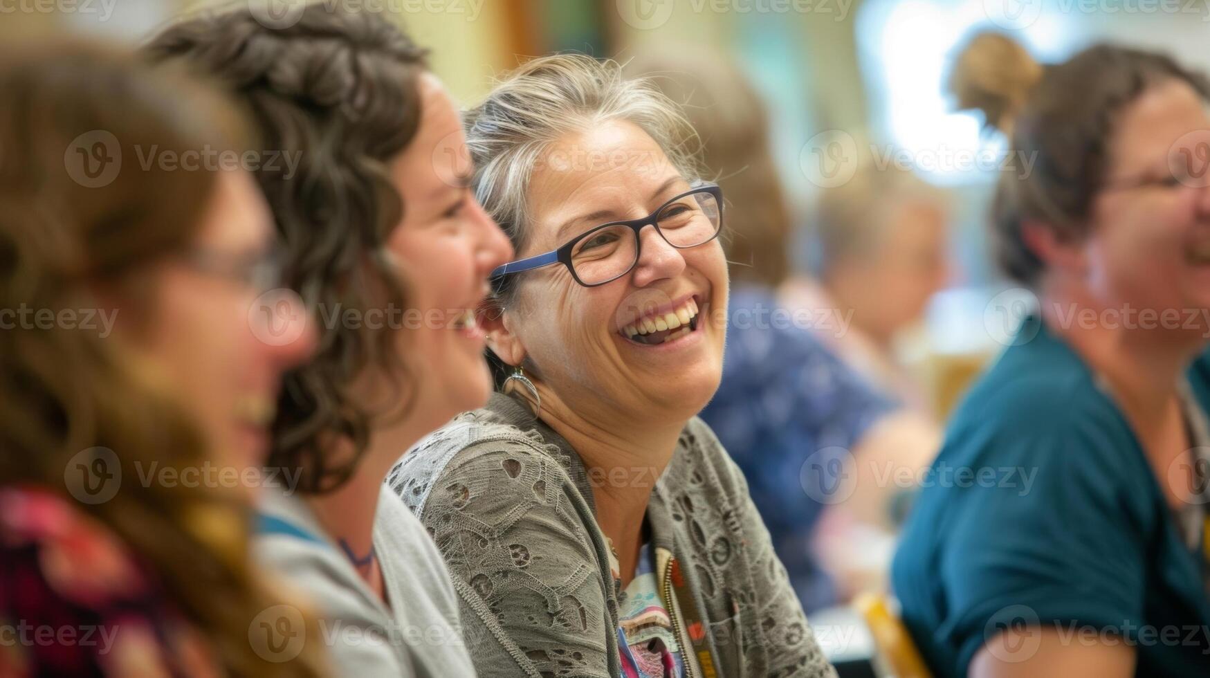 A lively atmosphere filled with laughter and conversation as workshop participants share their progress and techniques with one another photo