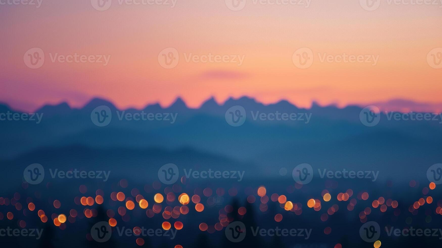 The peaks of the mountains seem to glow as if lit from within by the rosy alpenglow photo