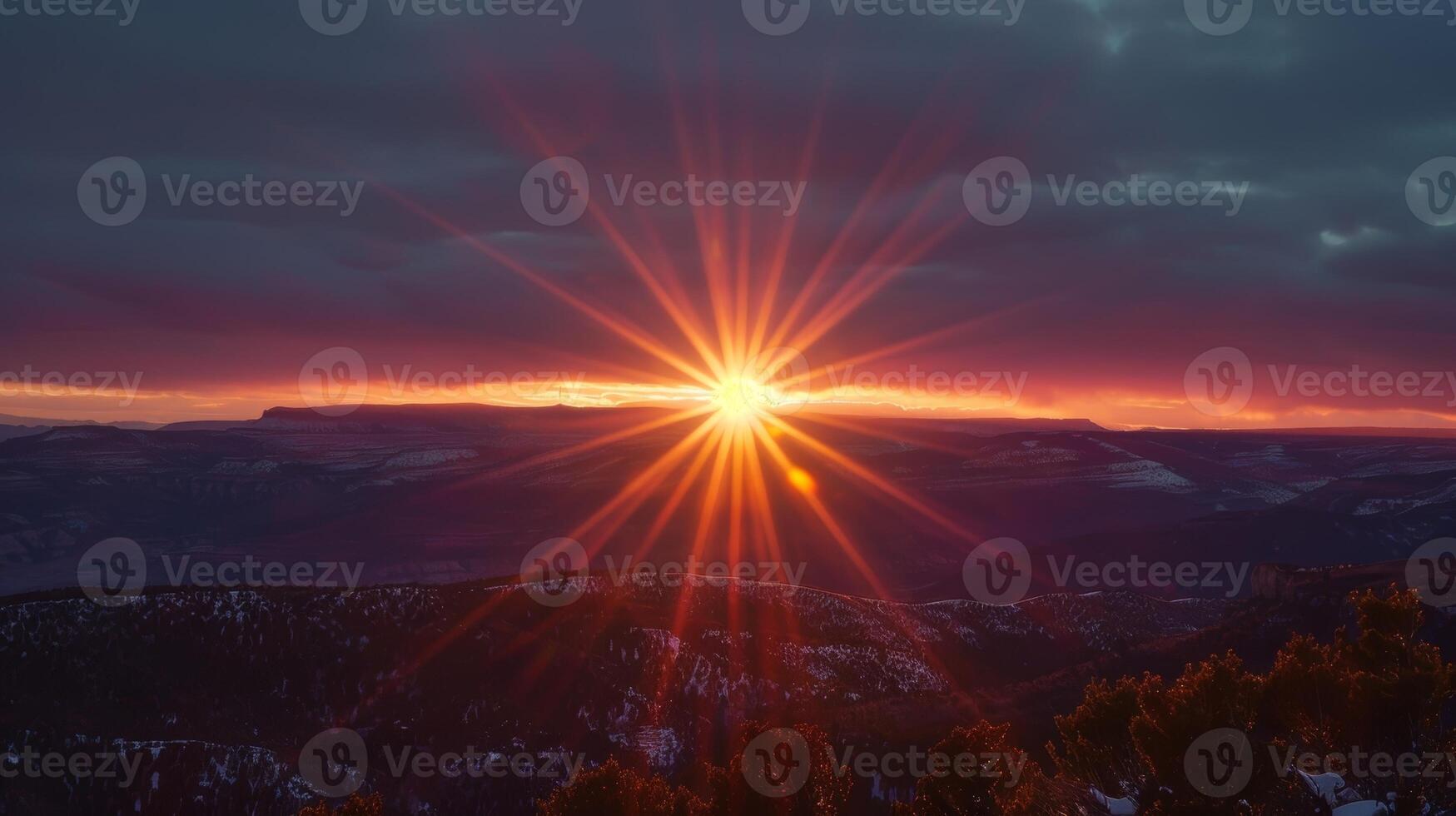 As the sun sets majestic columns of light rise up towards the sky giving the appearance of sun pillars photo