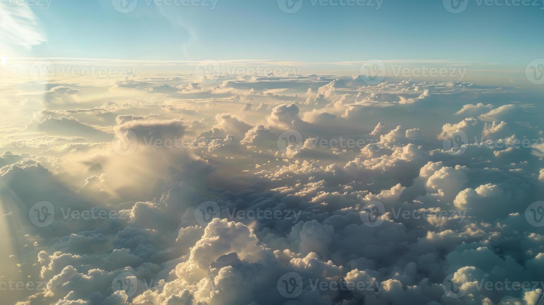 The view from a plane window with pyrocumulus clouds stretching out as far as the eye can see photo