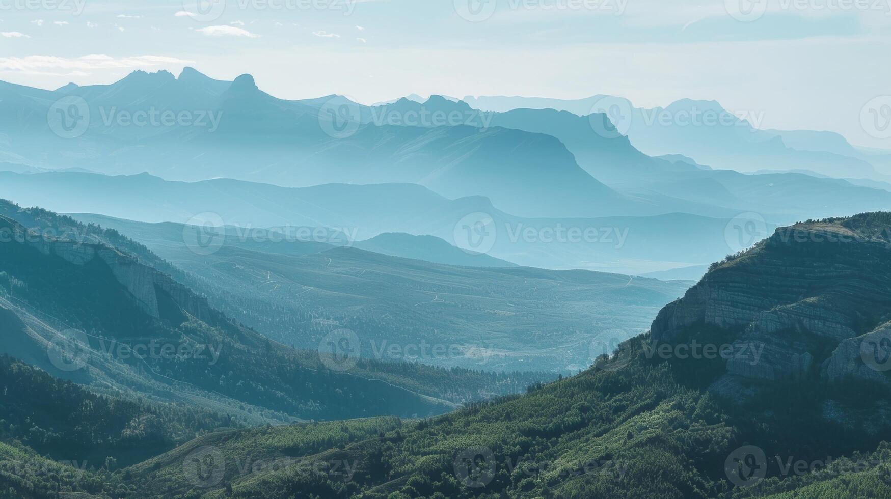 A vista of a vast mountain range and its shadow stretching out before an endless horizon photo