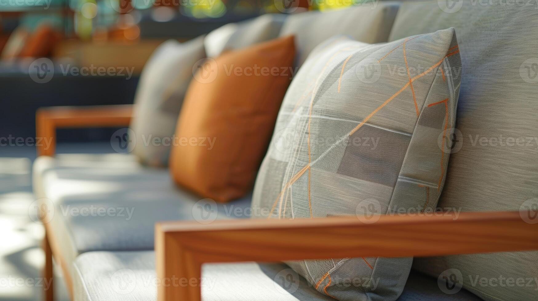 A sleek and modern outdoor sofa featuring a minimalist design and cushions made from recycled polyester fabric. The frame is made from sustainably sourced teak wood adding warmth t photo
