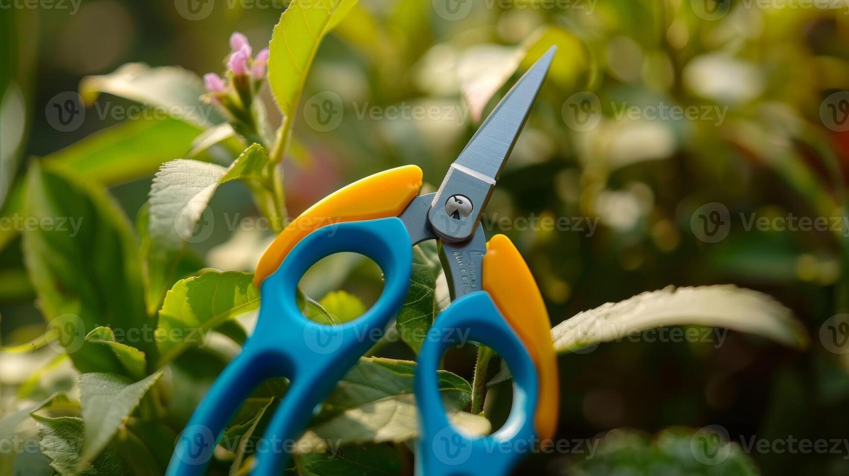 A pair of plastic garden scissors perfect for little ones to help with pruning and snipping photo