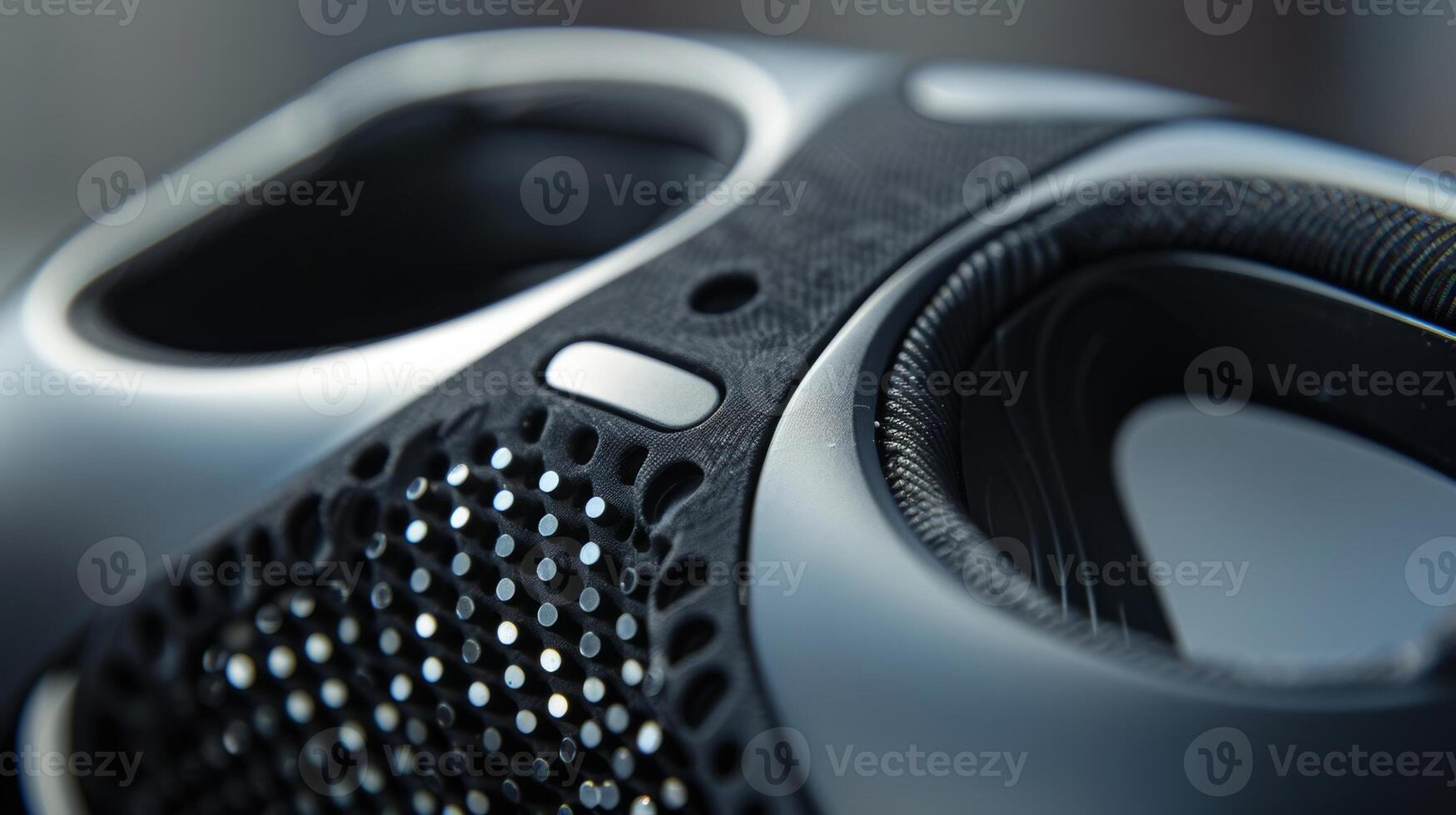 A closeup of the haptic feedback sensors on the side of the VR headset which have a smooth yet slightly bumpy texture for precise touch feedback photo