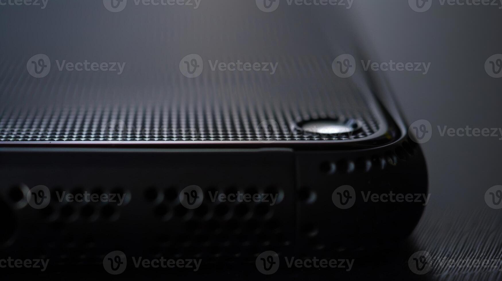 The texture of the casing is smooth but with a subtle raised grid pattern adding a touch of sophistication to the gadgets design photo