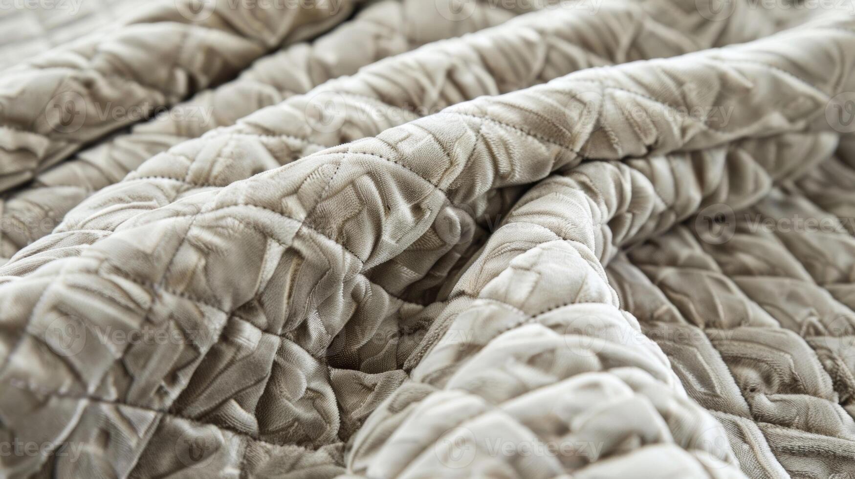 A velvety softness emanates from the intricate diamond patterns of this quilted fabric inviting you to snuggle in and relax photo