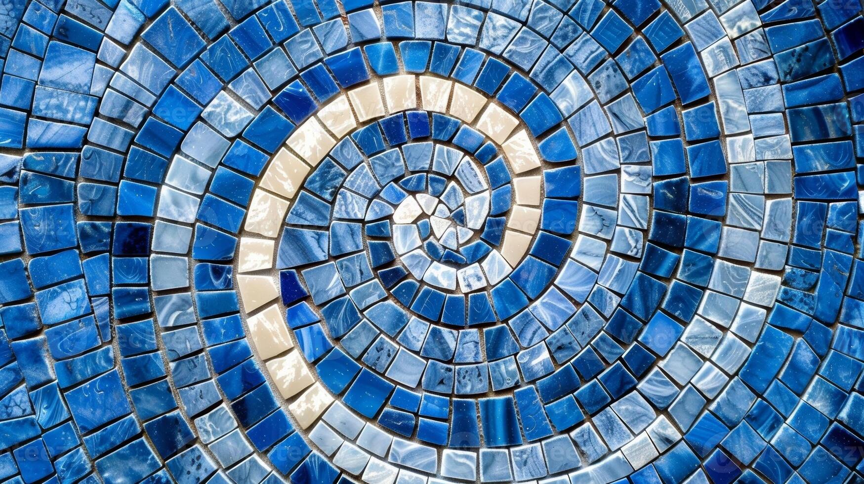 A textured closeup of glossy blue and white mosaic tiles creating a swirling hypnotizing effect as the tiles blend together in a stunning pattern photo