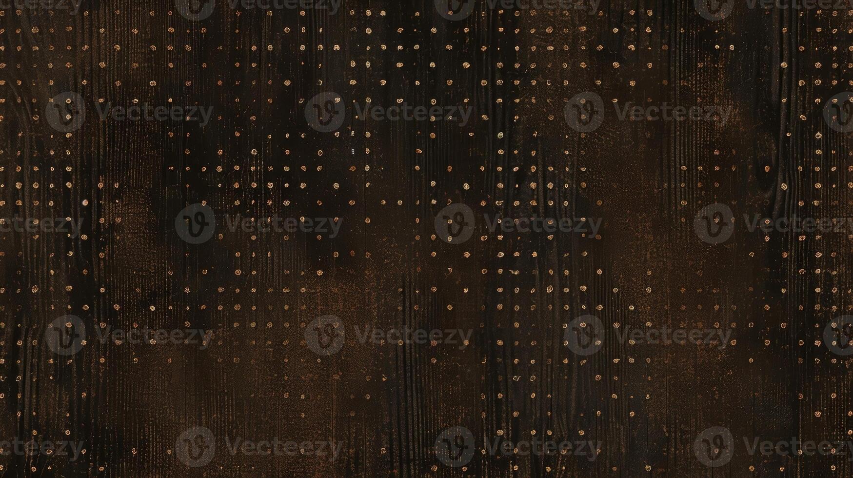 Tiny intricate dots and dashes create a subtle dotted texture on a dark brown surface photo