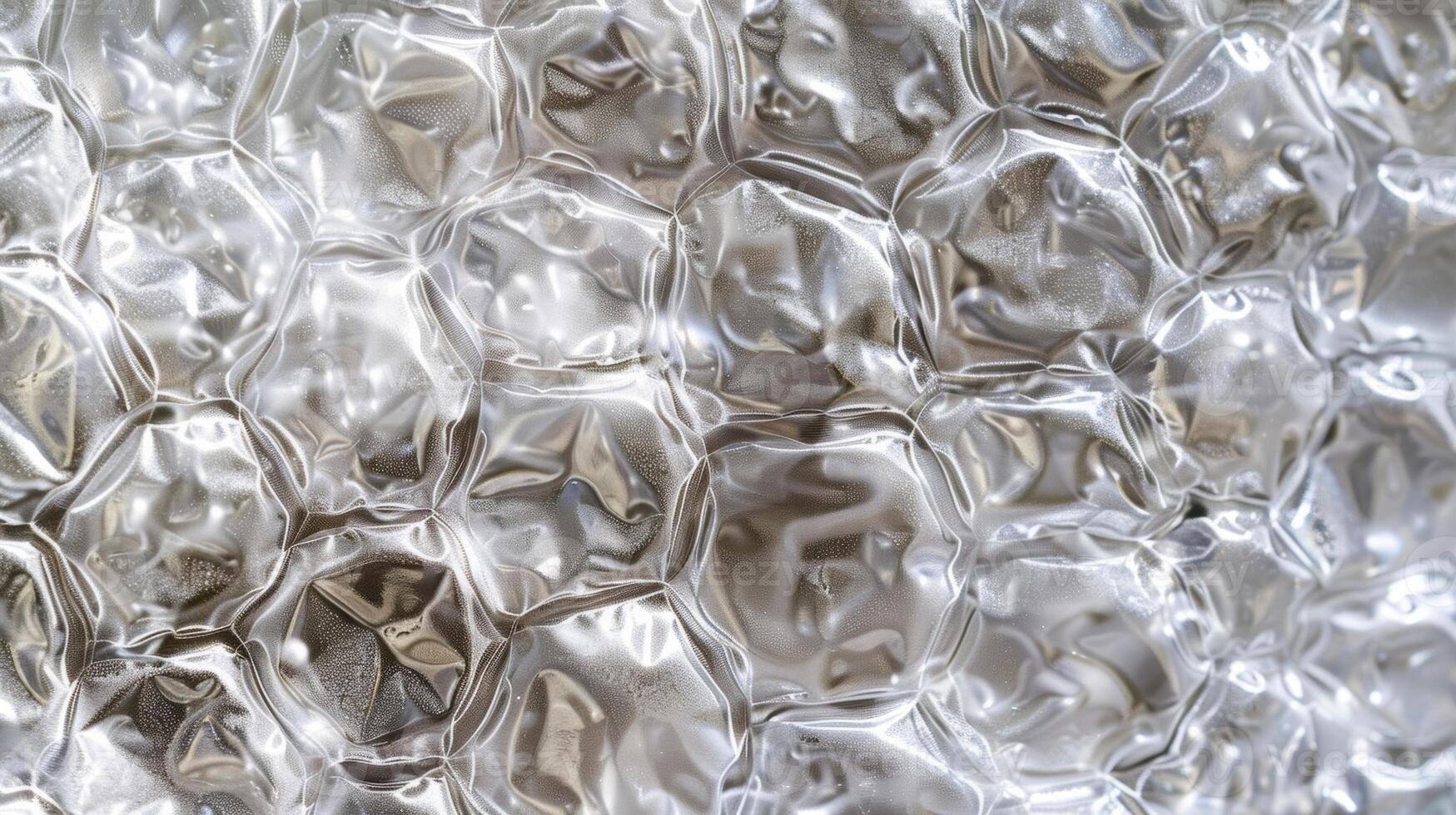 A macro shot of the bubble wrap reveals the intricate patterns created by the overlapping bubbles. Each bubble creates a small shadow behind it adding depth and dimension to the texture photo