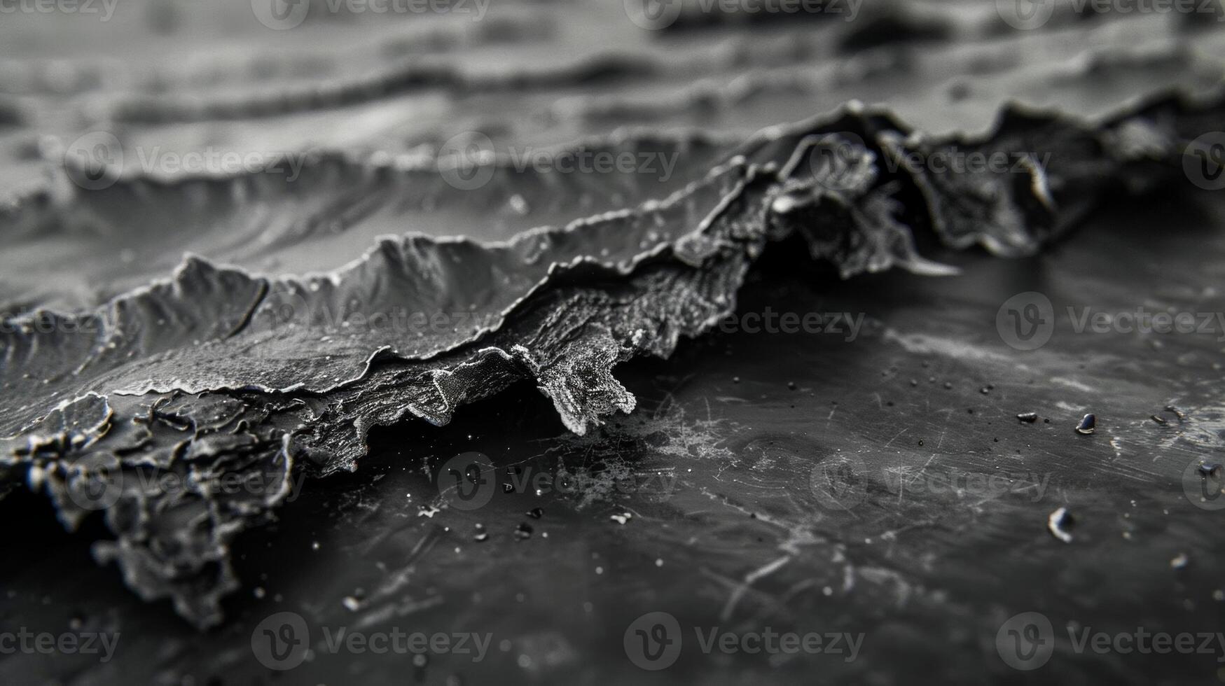 The edges of the graphene sheet are jagged and raw revealing the fractured nature of this incredibly thin yet strong material photo