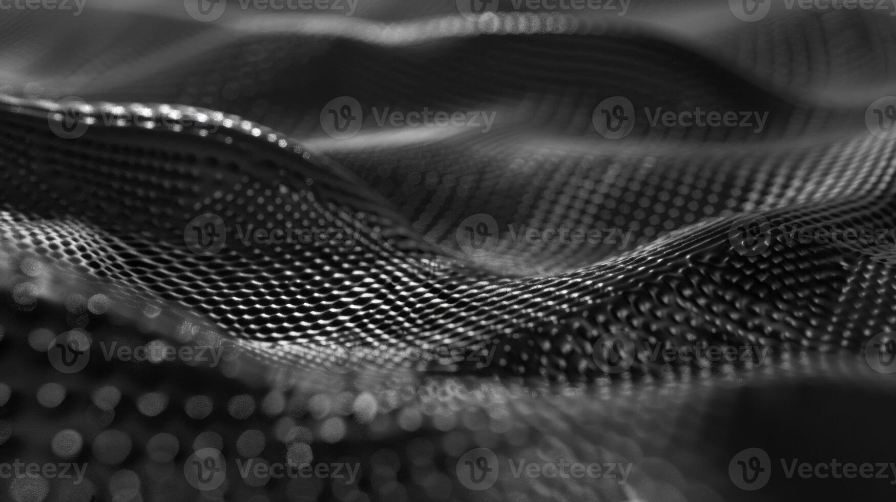 Fine almost imperceptible wrinkles and folds add depth and character to the otherwise flat and uniform surface of the graphene sheet photo
