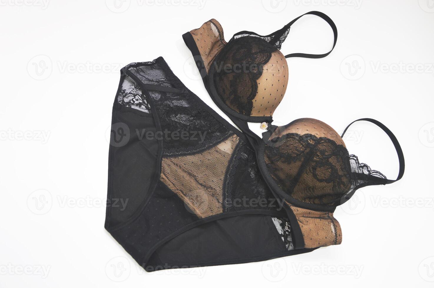 Lingerie. Beautiful luxury women's set of black lace underwear - bra and panties on a white background. photo
