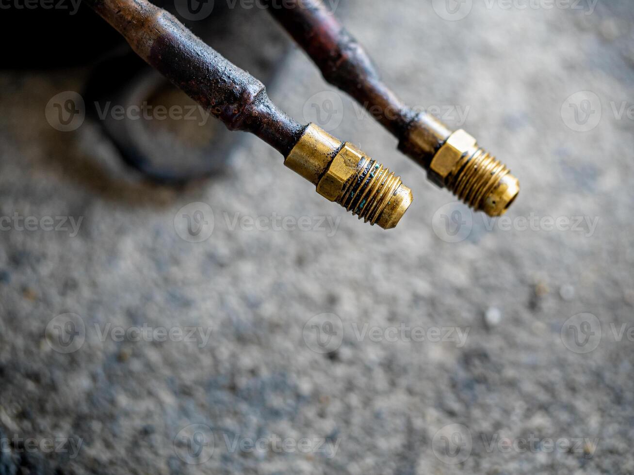 Air Conditioner Charging Hose on the rough concrete flooring photo