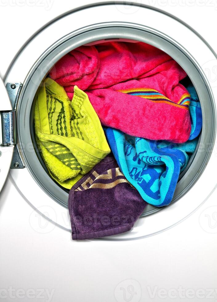A laundry room full of colorful clothes photo
